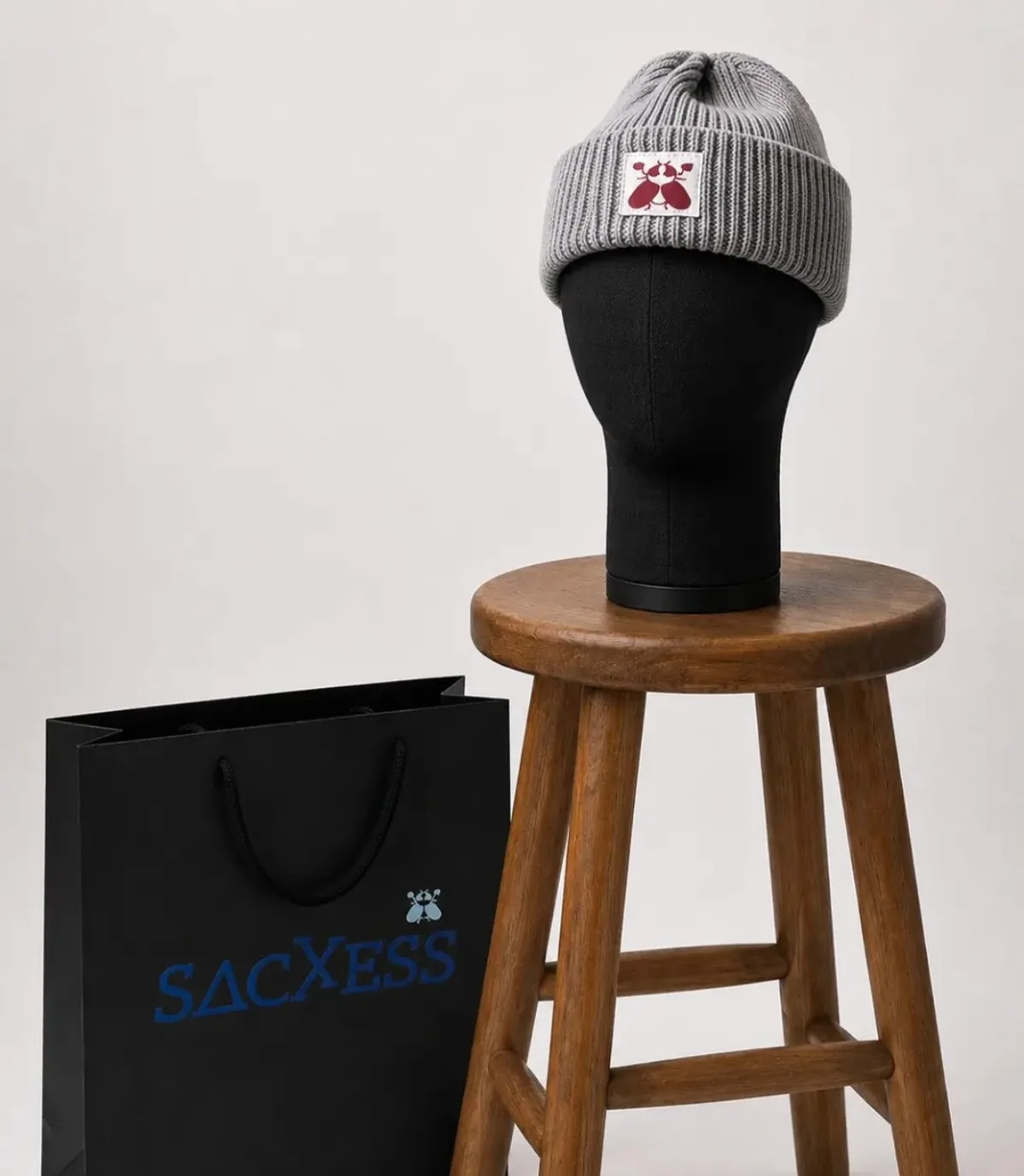 Fisherman Beanie in grey with an oxblood beetle woven label